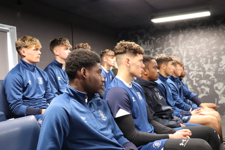 Luton Town academy players watch as Roseann Taylor from the VERU gives them a talk about knife crime