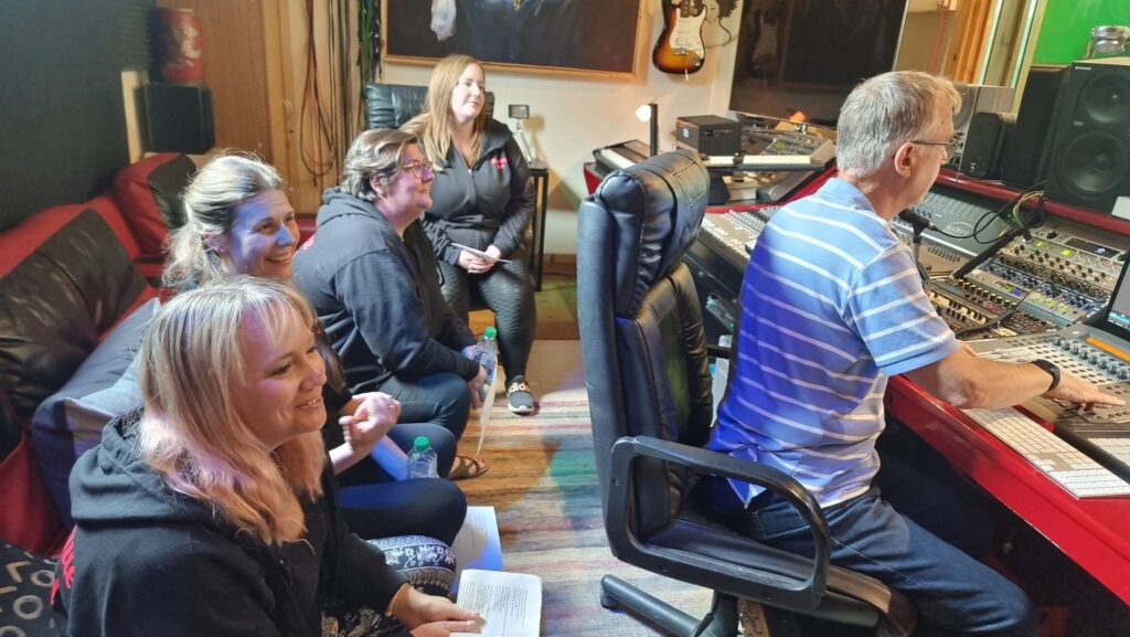 CLICK Arts Charity Single being recorded in a music studio